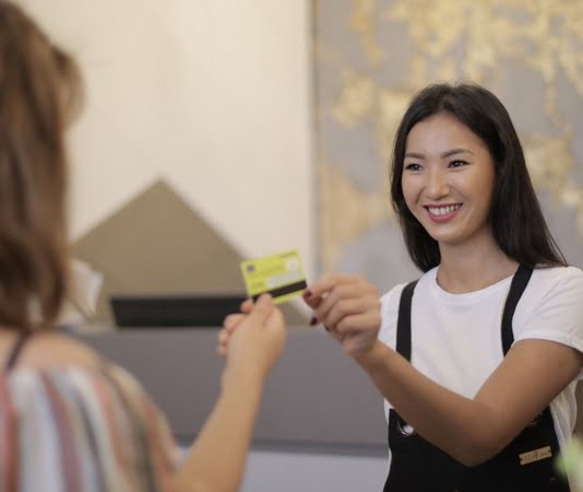 handing over a credit card