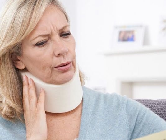 person wearing a neck brace