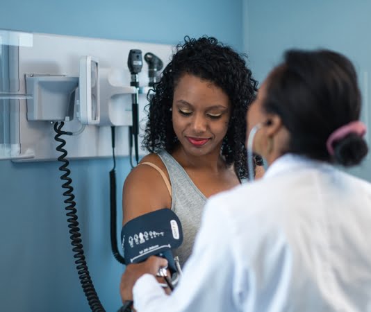 person having their blood pressure checked