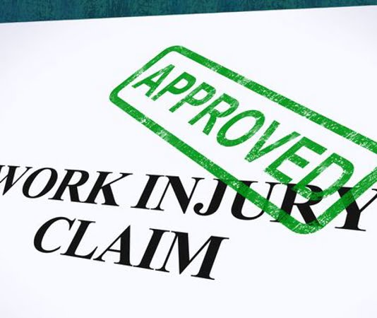 work injury claim document with approved stamp on it